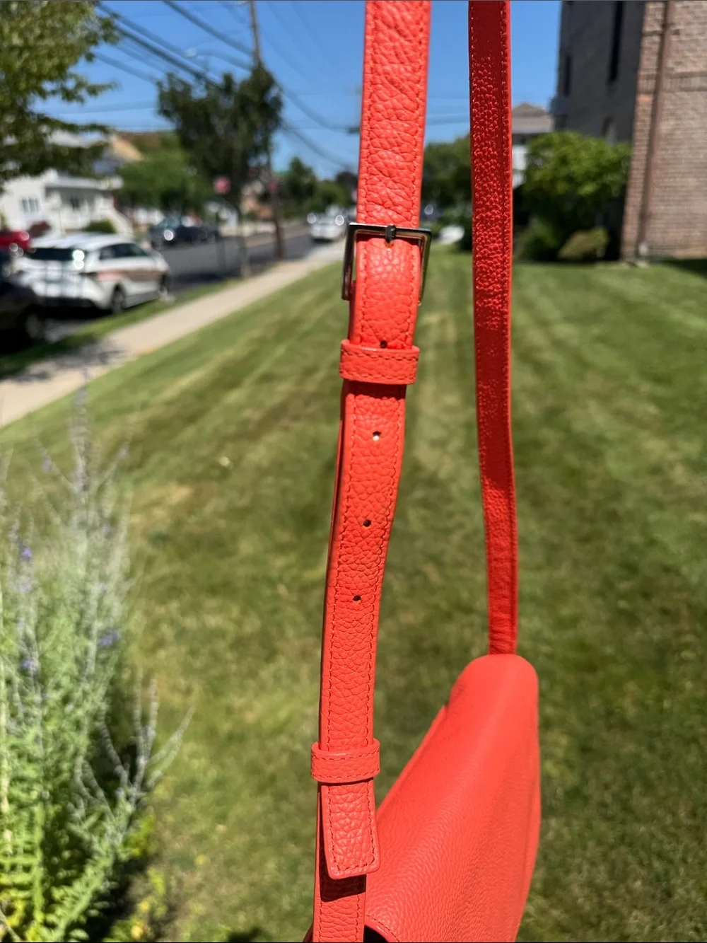 kate spade coral orange pebbled leather crossbody with tassels